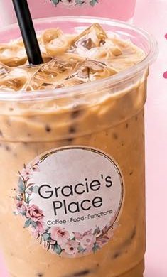 An iced coffee over ice in a Gracie's Place cup