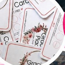 A pile of Gracie's Place loyalty cards